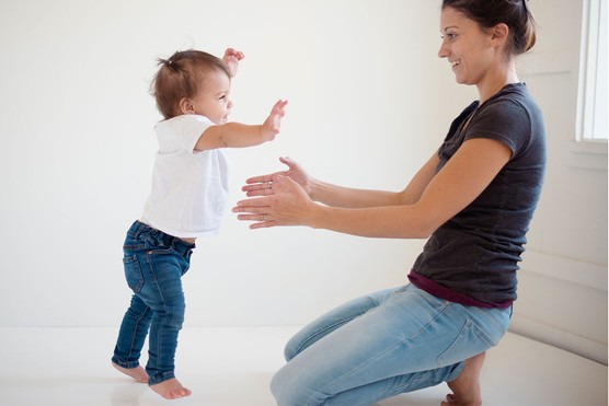 baby taking first steps