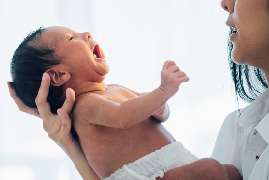 baby crying concerned mum