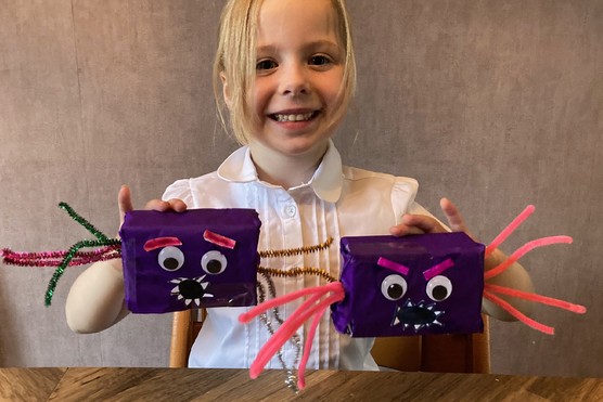 Child holding Halloween Box Spiders