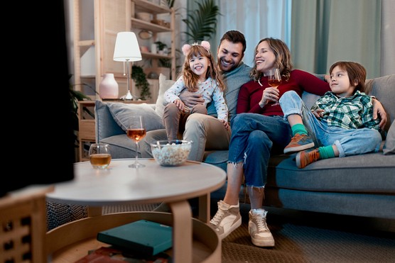 family having a movie night at home with popcorn