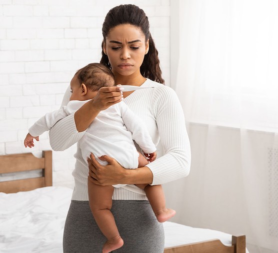mum taking baby's temperature