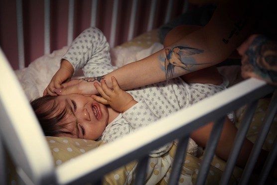 parent comforting crying child