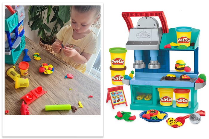 Play-Doh Kitchen Creations Busy Chef's Restaurant Playset being tested by child Play-Doh Kitchen Creations Busy Chef's Restaurant Playset being tested by child