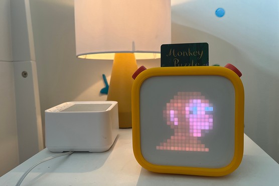 Yoto player on a bedside table playing Monkey Puzzle by Julia Donaldson and Axel Scheffler