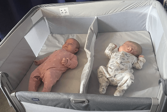 Babies asleep in Chicco Next2Me Twin crib with drop-down side Babies asleep in Chicco Next2Me Twin crib with drop-down side