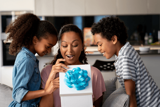 Children giving gift to mum on Mother's Day