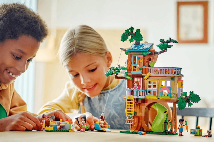 children playing with LEGO Friendship tree set