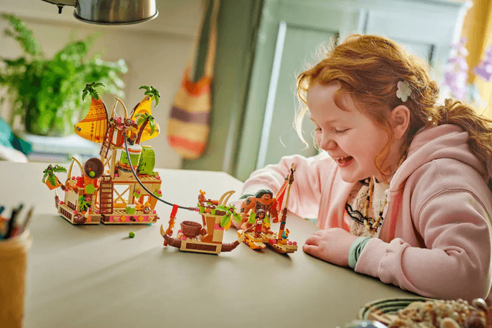 Child playing with Kakamora Barge LEGO set