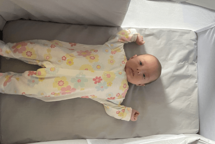 One baby lying in Chicco Next2Me Twin crib One baby lying in Chicco Next2Me Twin crib